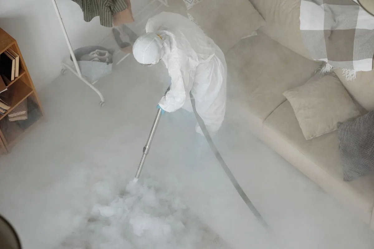 Biohazard cleanup technician in protective equipment, Redmond, OR